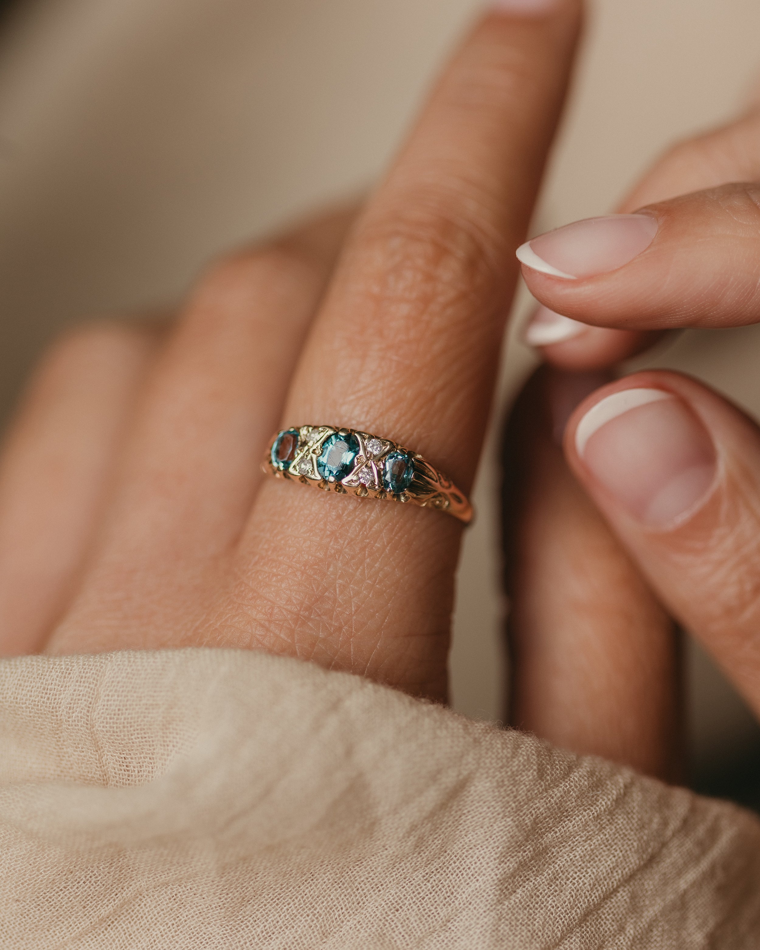 Image of Antonia 1989 Vintage 9ct Gold Blue Topaz & Diamond Seven Stone Ring