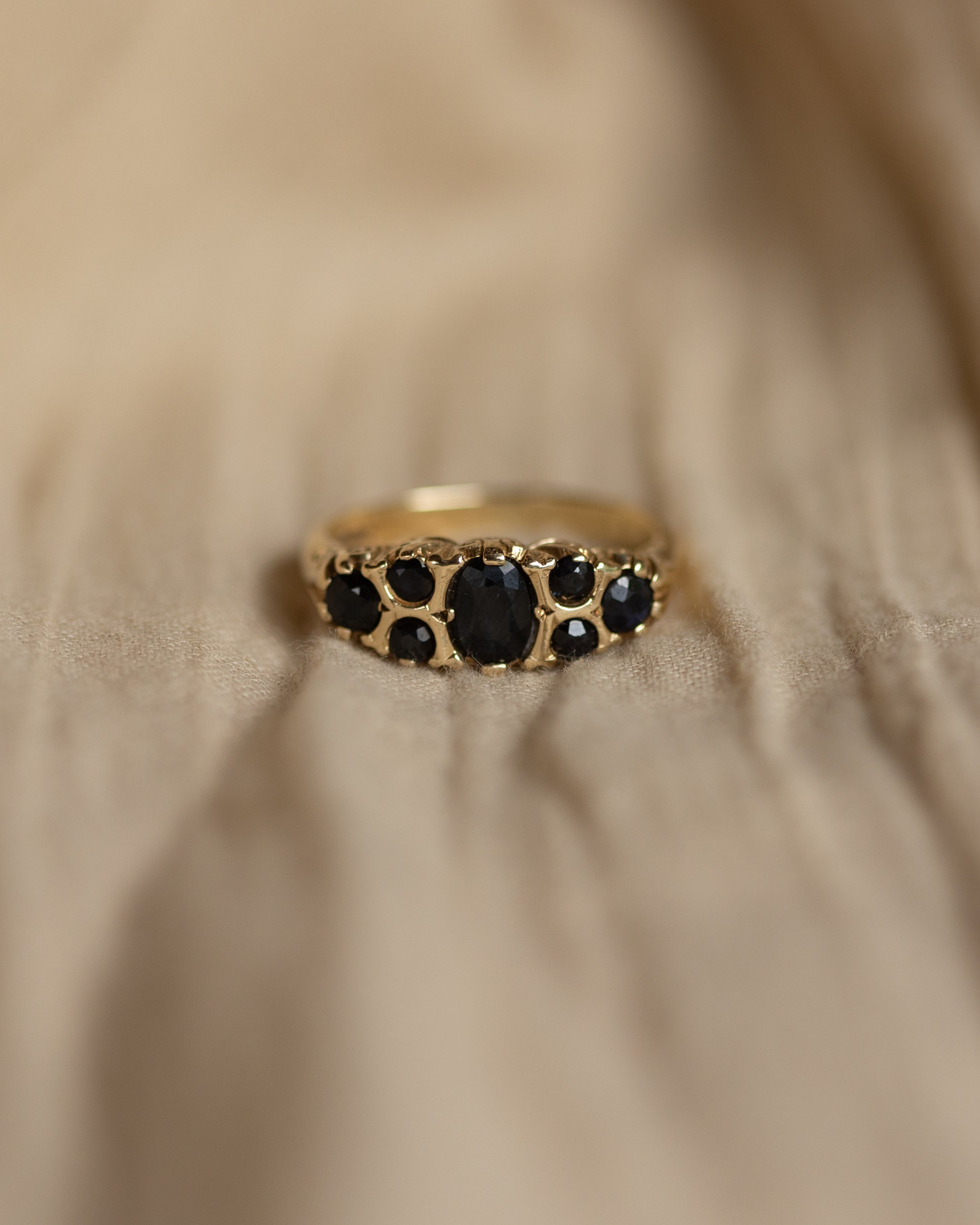 Image of Rowena Vintage 9ct Gold Sapphire Seven Stone Ring