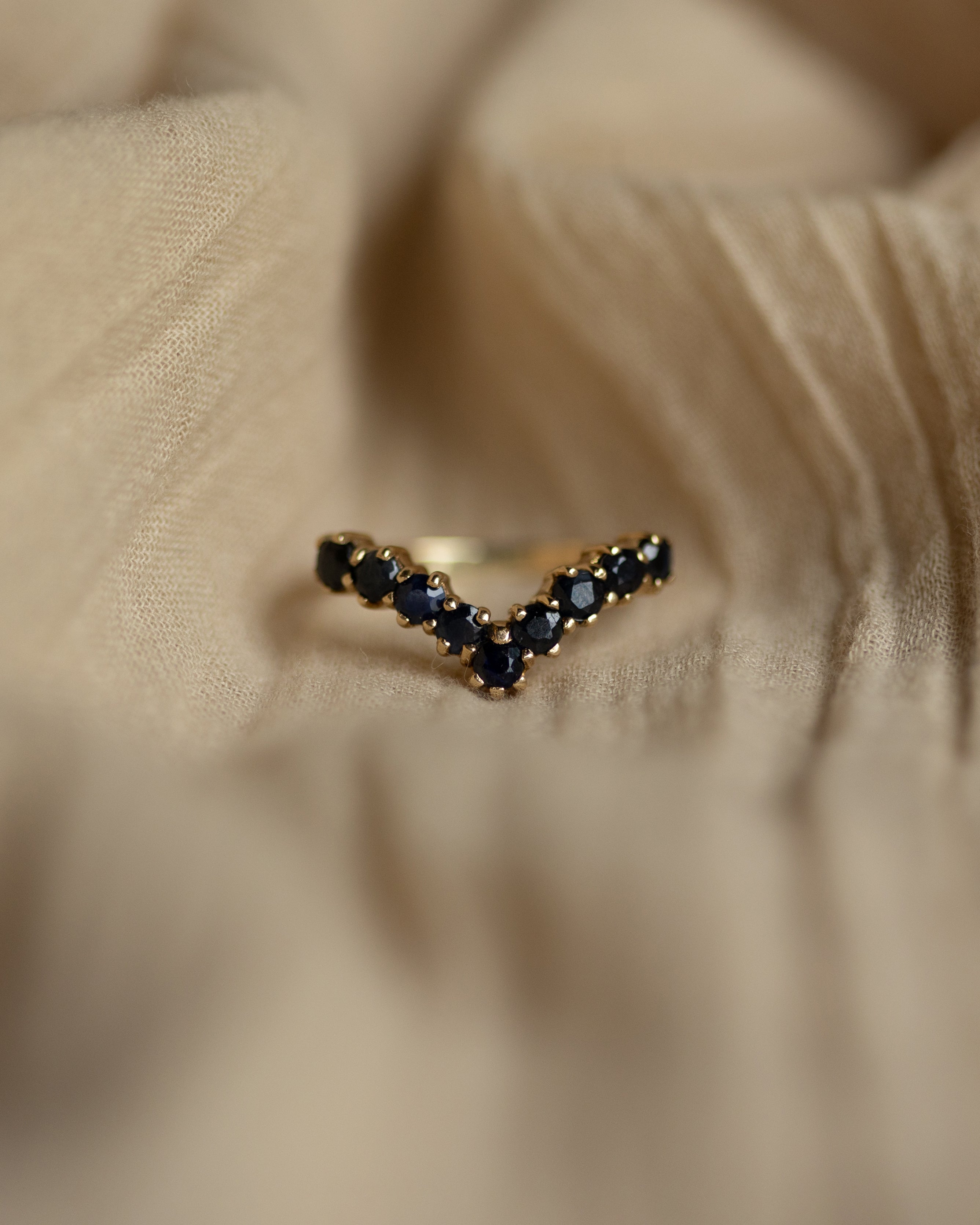 Image of Sadie 1981 Vintage 9ct Gold Sapphire Wishbone Half Eternity Ring