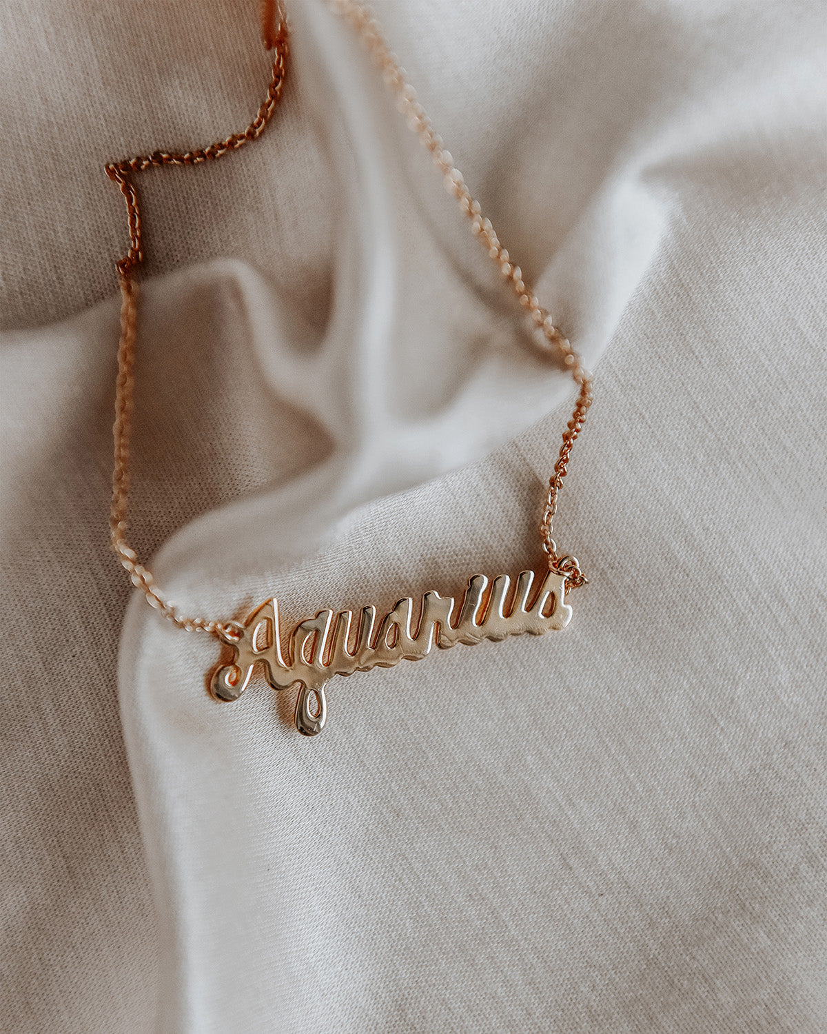 Aquarius gold chain on sale
